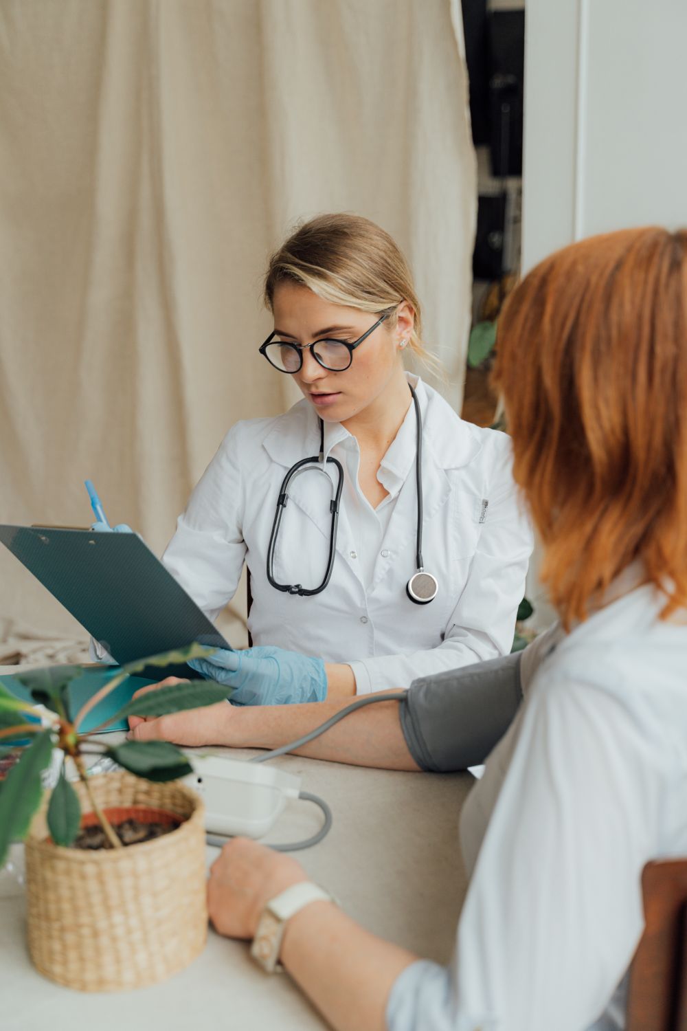 Illustrative stock photograph of a doctor discussing care with a patient