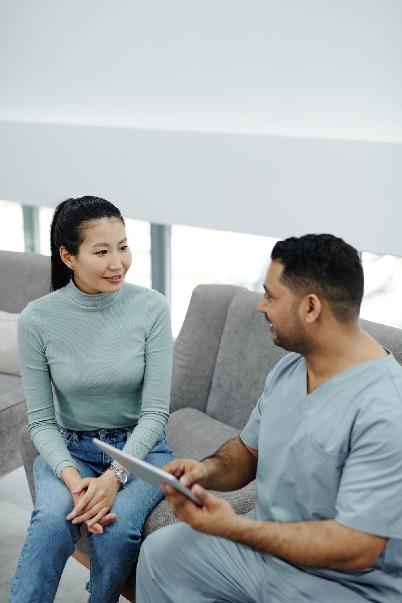 Illustrative stock photograph of a patient speaking with a healthcare professional